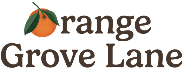 Logo of Orange Grove Lane with an orange and leaf on a white background